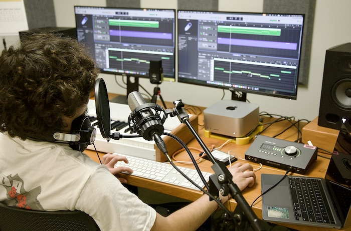 a student using the audio mixing station