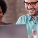 image of two people working together on a laptop