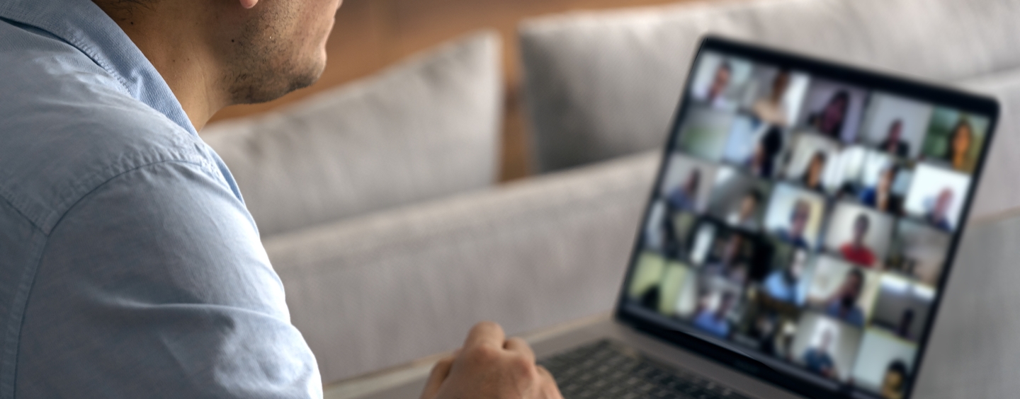 man on a laptop displaying a Zoom call