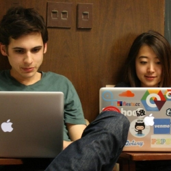 Two students on their laptops