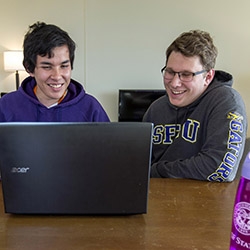 students with laptop