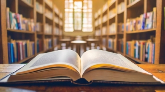 open book on a table in a library